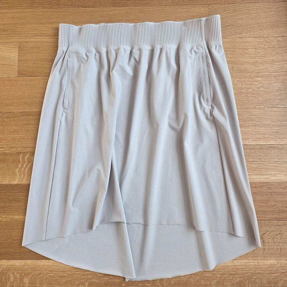 ATHLETA Cosmic Hi Lo Skirt Pockets Comfy Stretch Travel Beige Tan XL